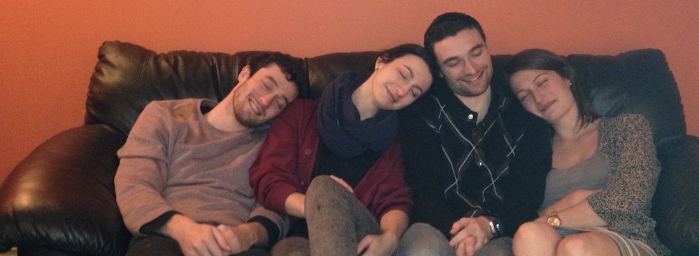 Four siblings pretending to sleep on each other's shoulders